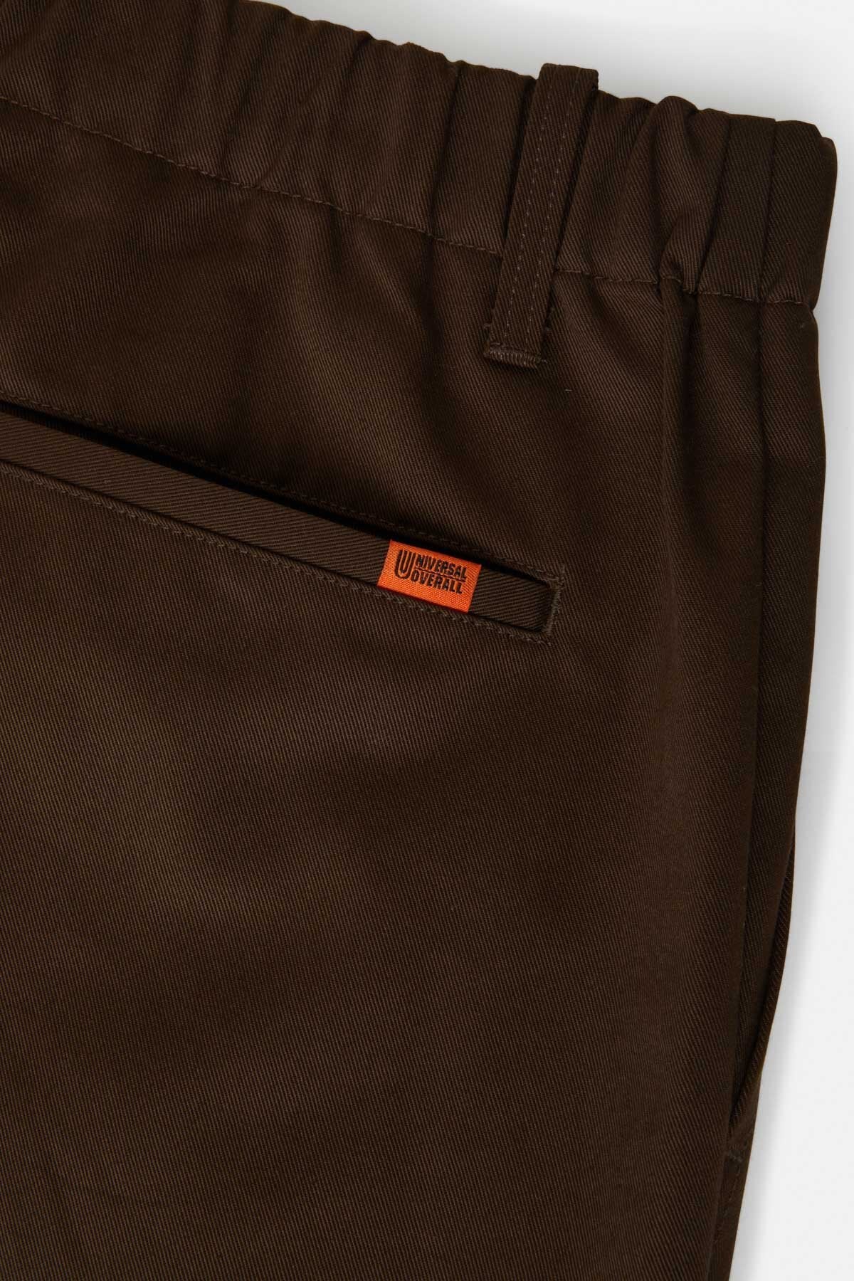 Pantaloni in twill con pinces e gamba affusolata